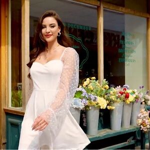 Beautiful white, short lace dress. Boutique style bridal, graduation Spring